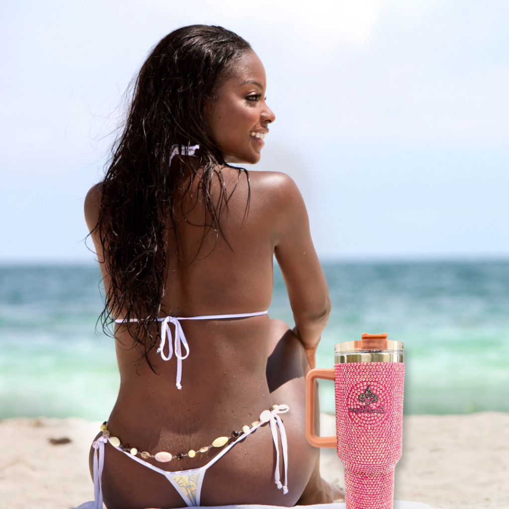 Lady on beach with 40oz Bling Tumbler with handle and straw Stanley H1.0 bedazzled with Premium Rhinestones Pink